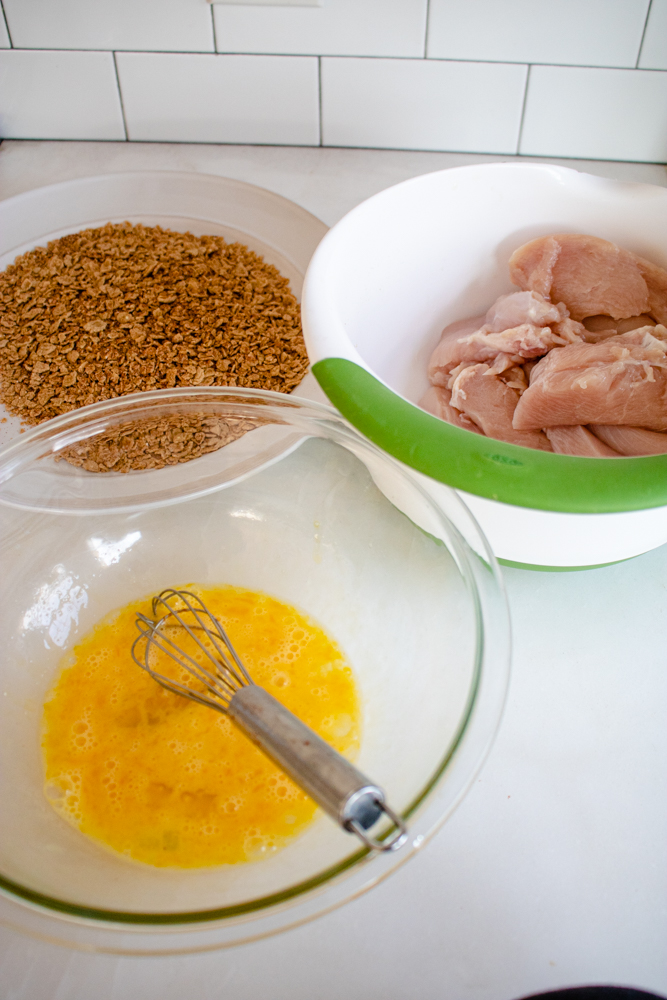 All the ingredients you need to make this easy chicken tenders recipe: 1 lb chicken tenders or chicken breast cut into strips, eggs, and the corn flakes seasoning mixture.